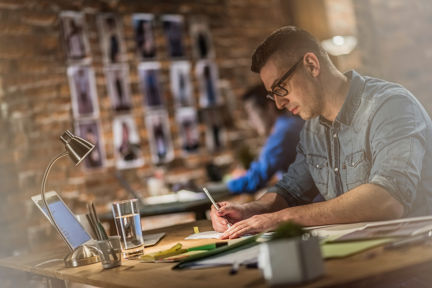 Graphic designer making sketches behind a desk